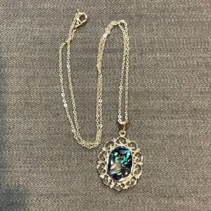 2 necklaces. - Oval necklace, silver tone and silver tone chain 22”.